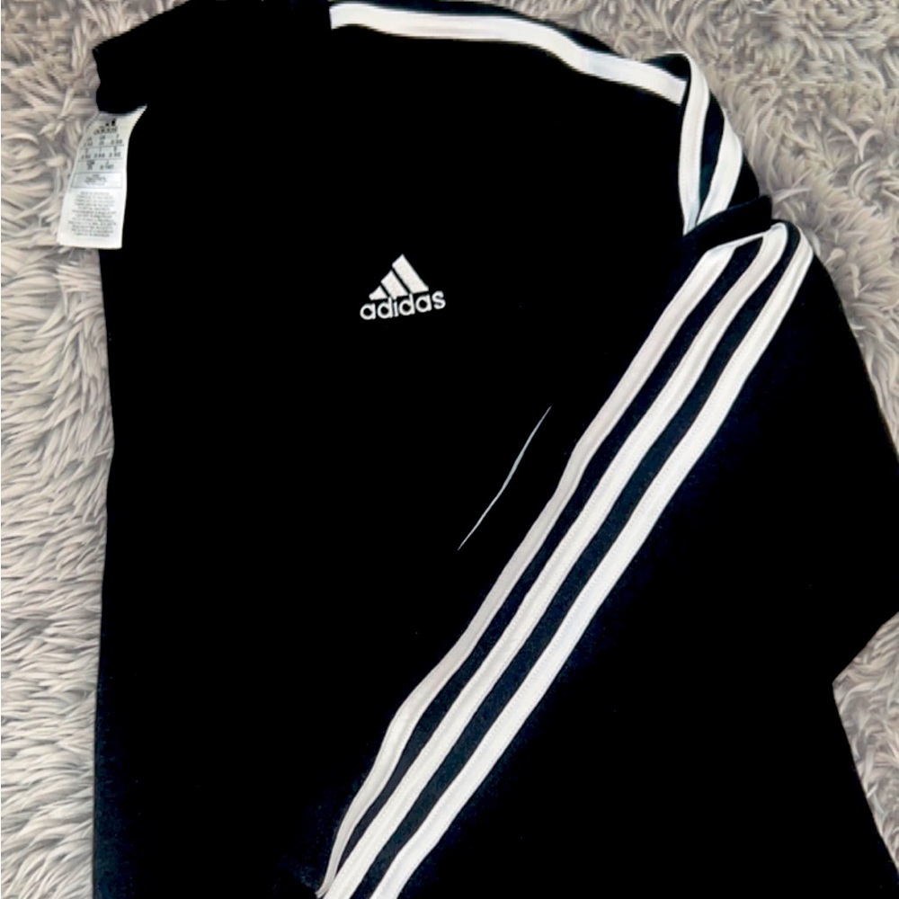 Women’s black Adidas plus size crew neck sweatshirt. New without tags.